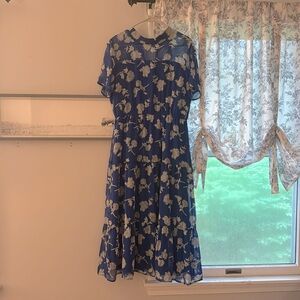 Blue Floral dress, fully lined. Sheer around the neck , elastic waist